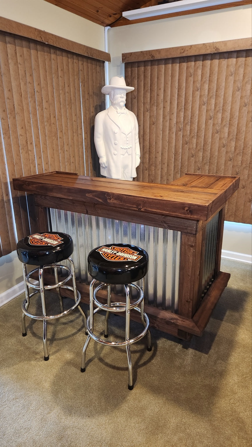 Brown wood and corrugated metal bar with two Harley-Davidson stools indoors